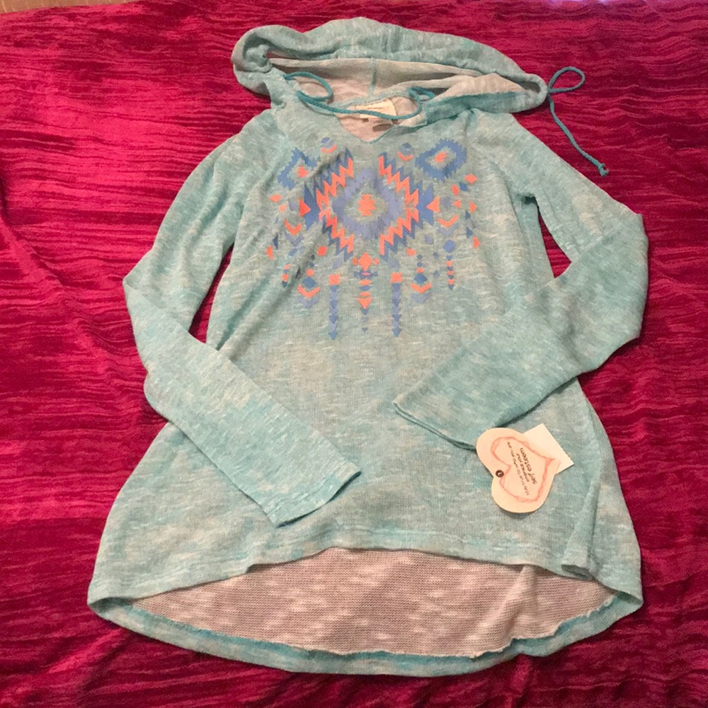 Teal long sleeved top with Aztec design. NWT